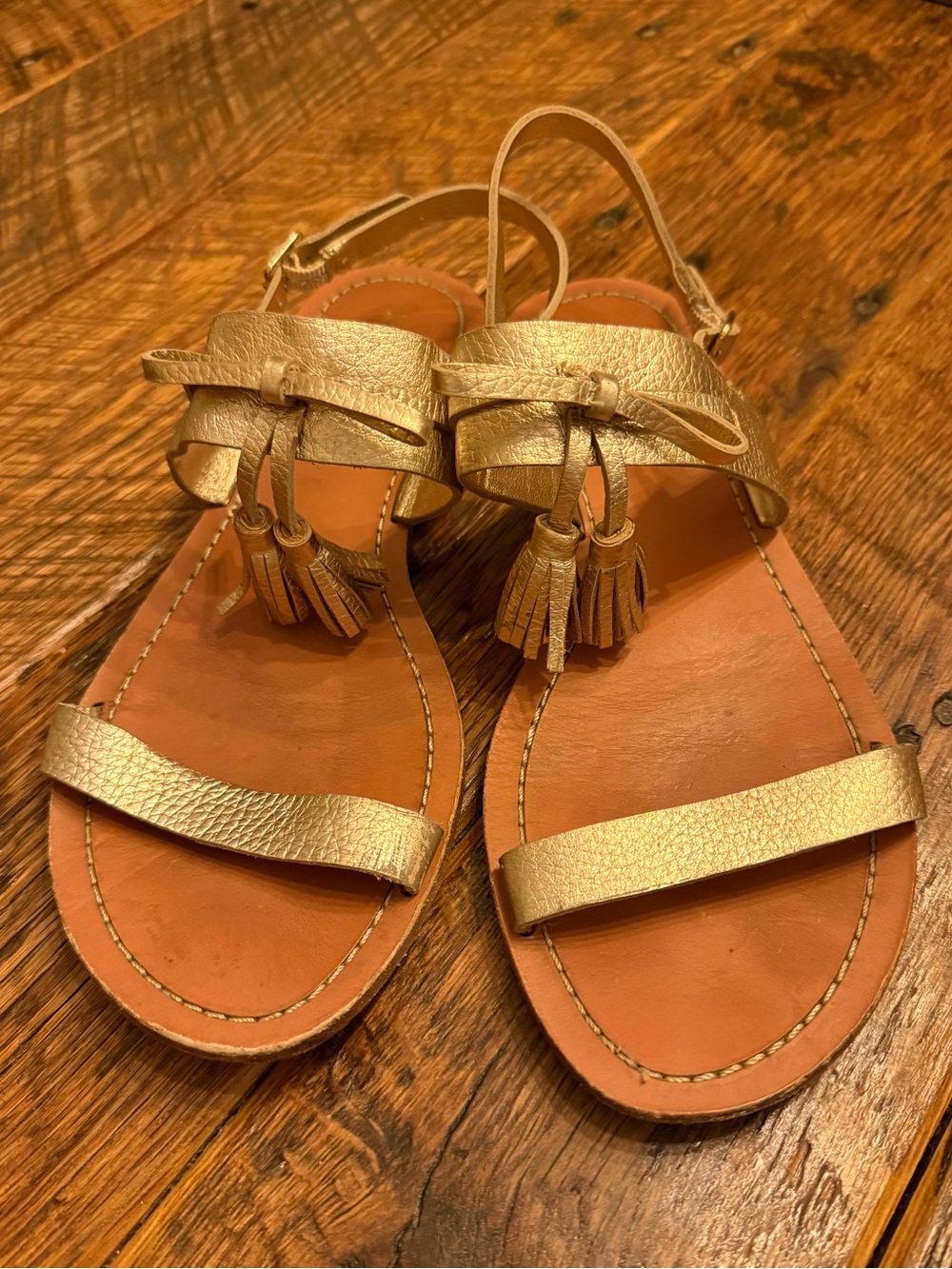 kate spade Metallic Gold Leather Tassel Flat Sandals